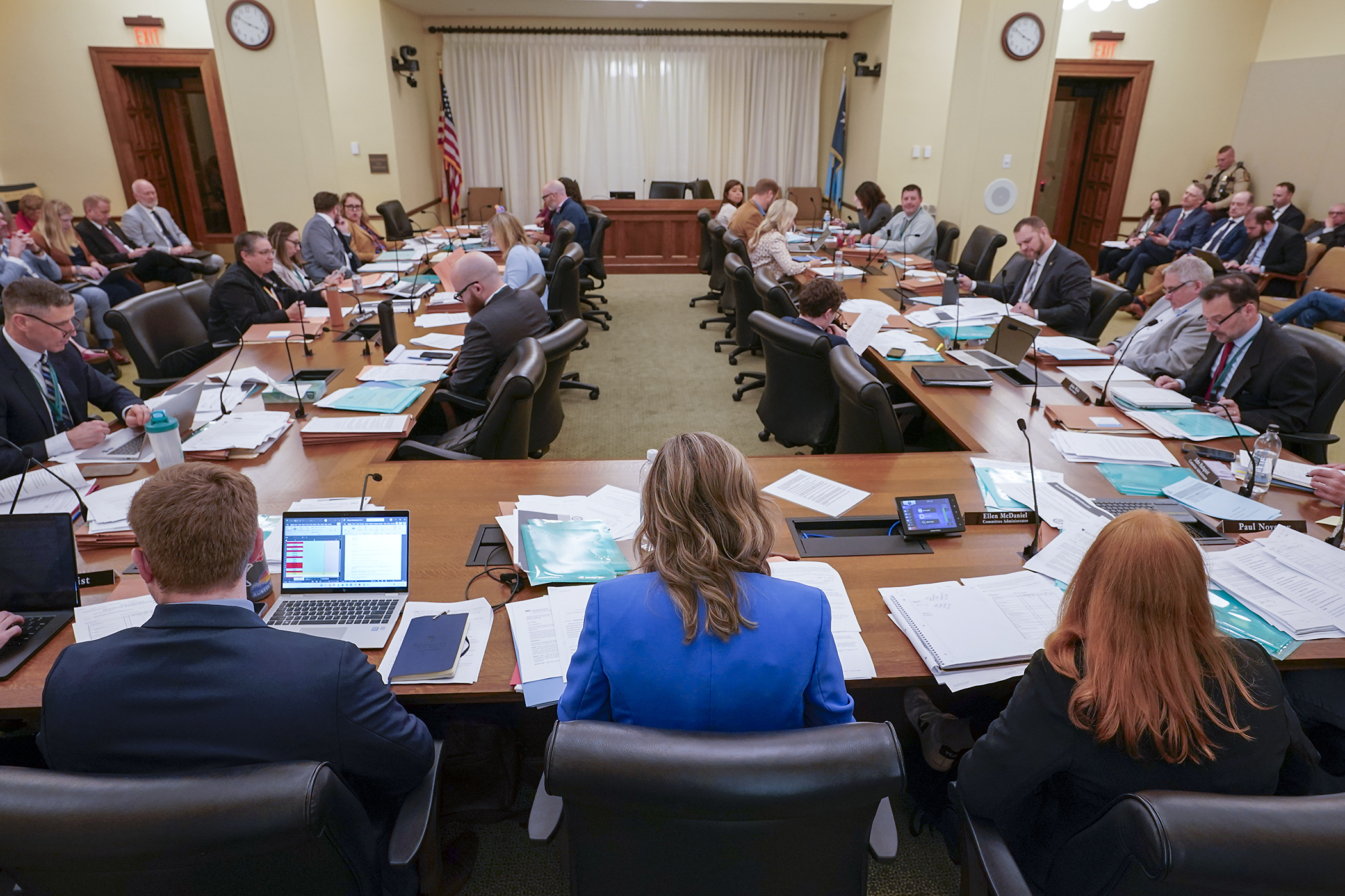 The House Public Safety Finance and Policy Committee listens Tuesday as nonpartisan staff conduct a walkthrough of HF1082, the public safety finance and policy supplemental appropriations bill. (Photo by Michele Jokinen)